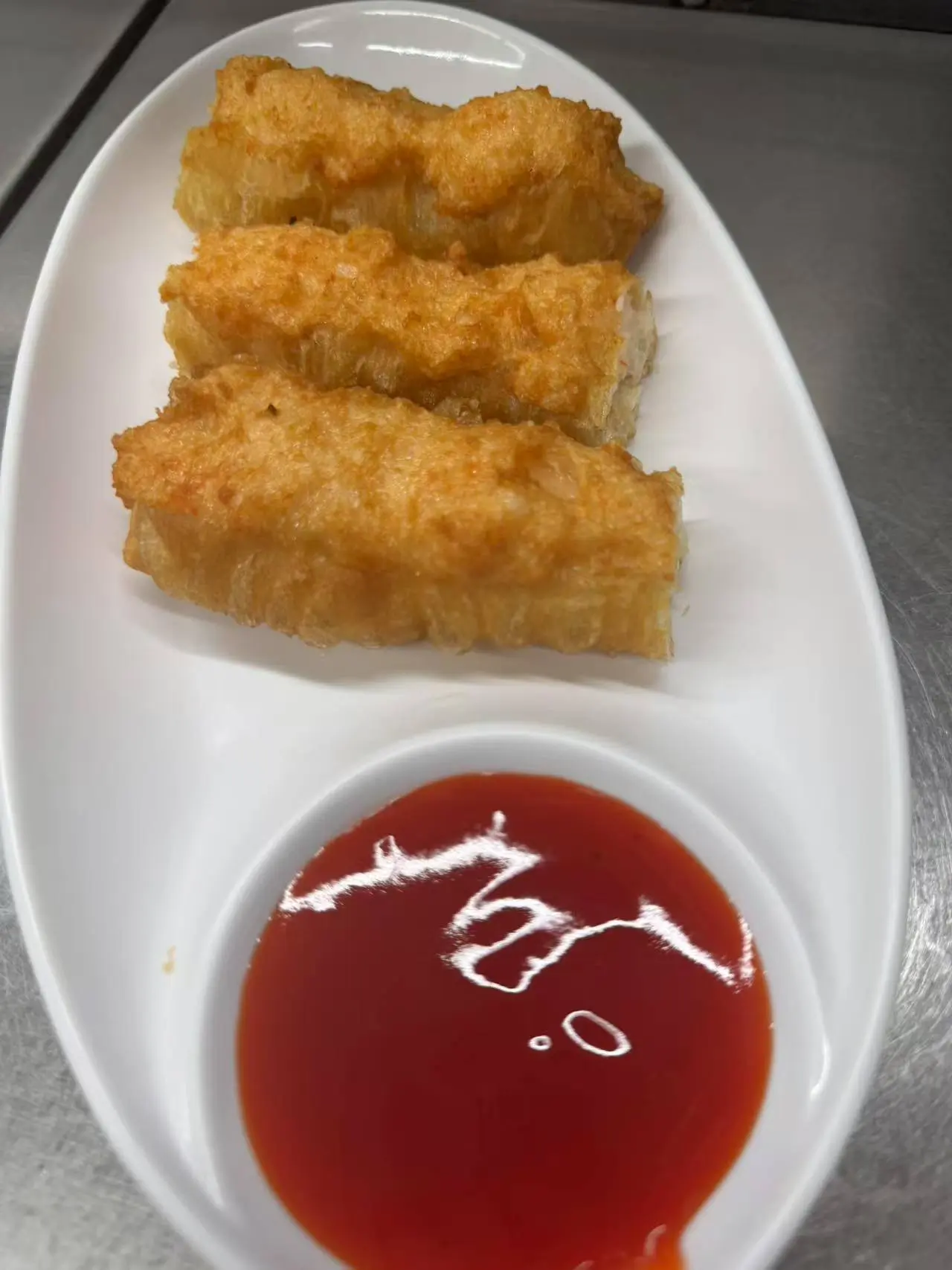 NEW-Golden-Lotus-Chinese-Restaurant-Fried-Spring-Rolls-Orlando Fried Spring Rolls - Crispy - fried spring rolls served with a side of sweet chili sauce at NEW Golden Lotus Chinese Restaurant in Orlando